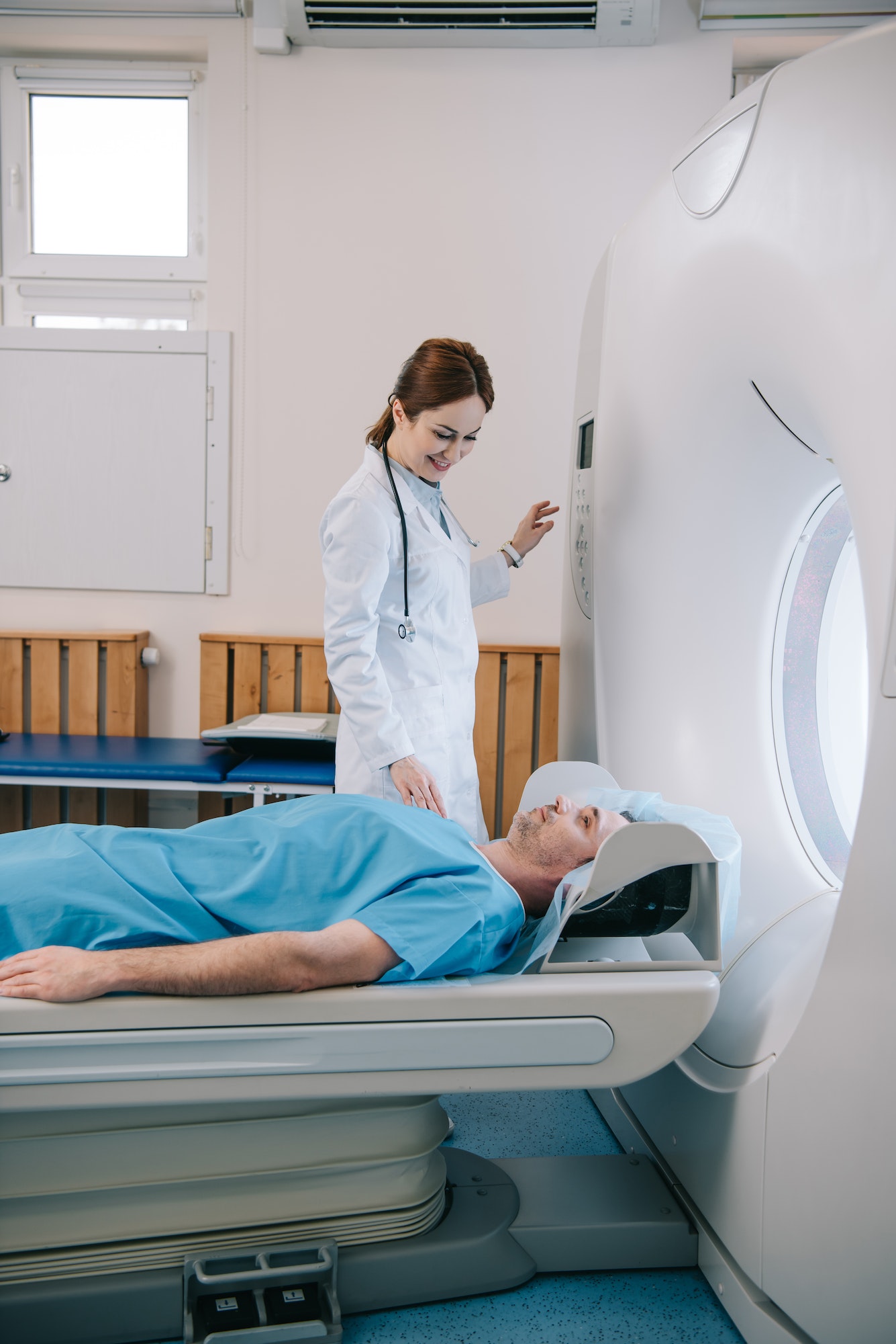 attractive-smiling-doctor-preparing-man-for-scanning-in-mri-machine.jpg